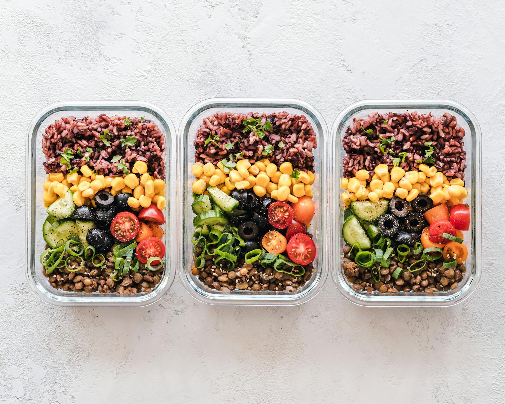 flat lay photography of three tray of foods