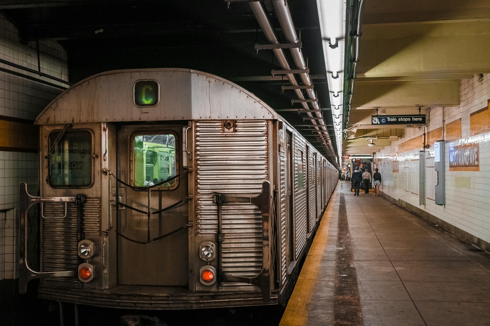 gray train in subway station