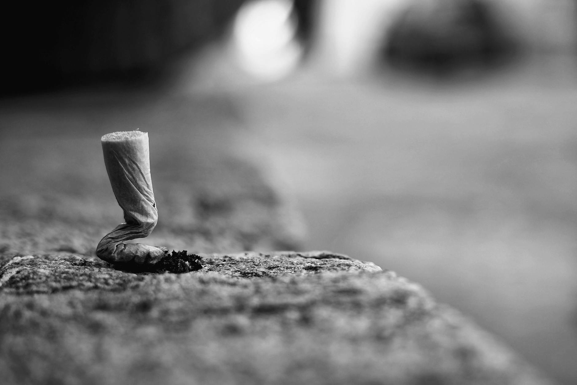 grayscale photo of cigarette butt