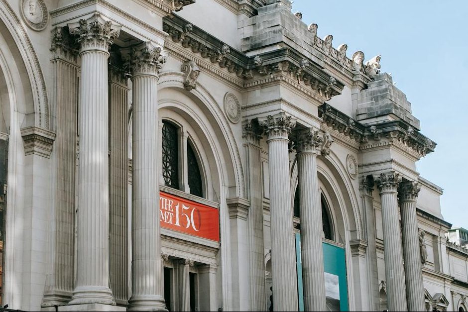 facade of famous art museum with columns and sculptures