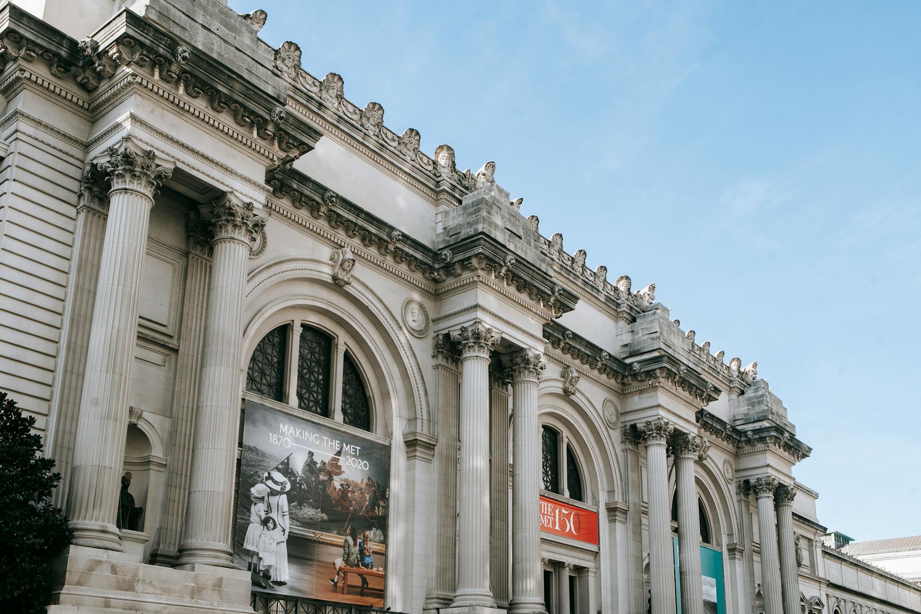 facade of famous art museum with columns and sculptures